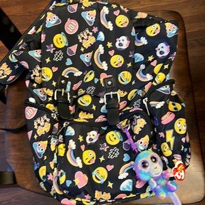 Emoji backpack with TY Bernie baby attached.